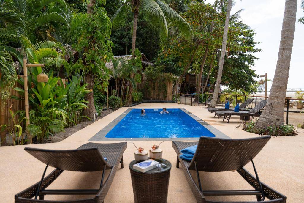 Completed Nova 8M fiberglass pool at a tropical property